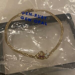 Elegant Gold Bracelet with Ruby and Opal Accents